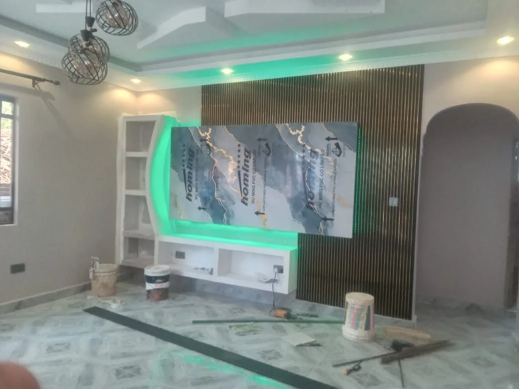 TV wall unit with green LED backlighting during installation