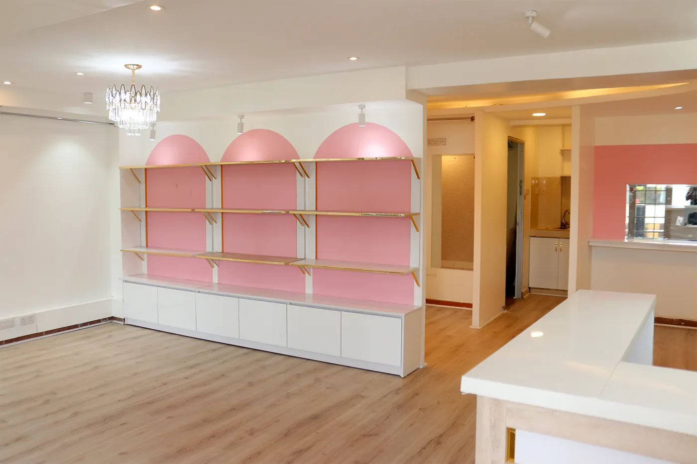 Boutique retail corner with arched shelving, Ruaka