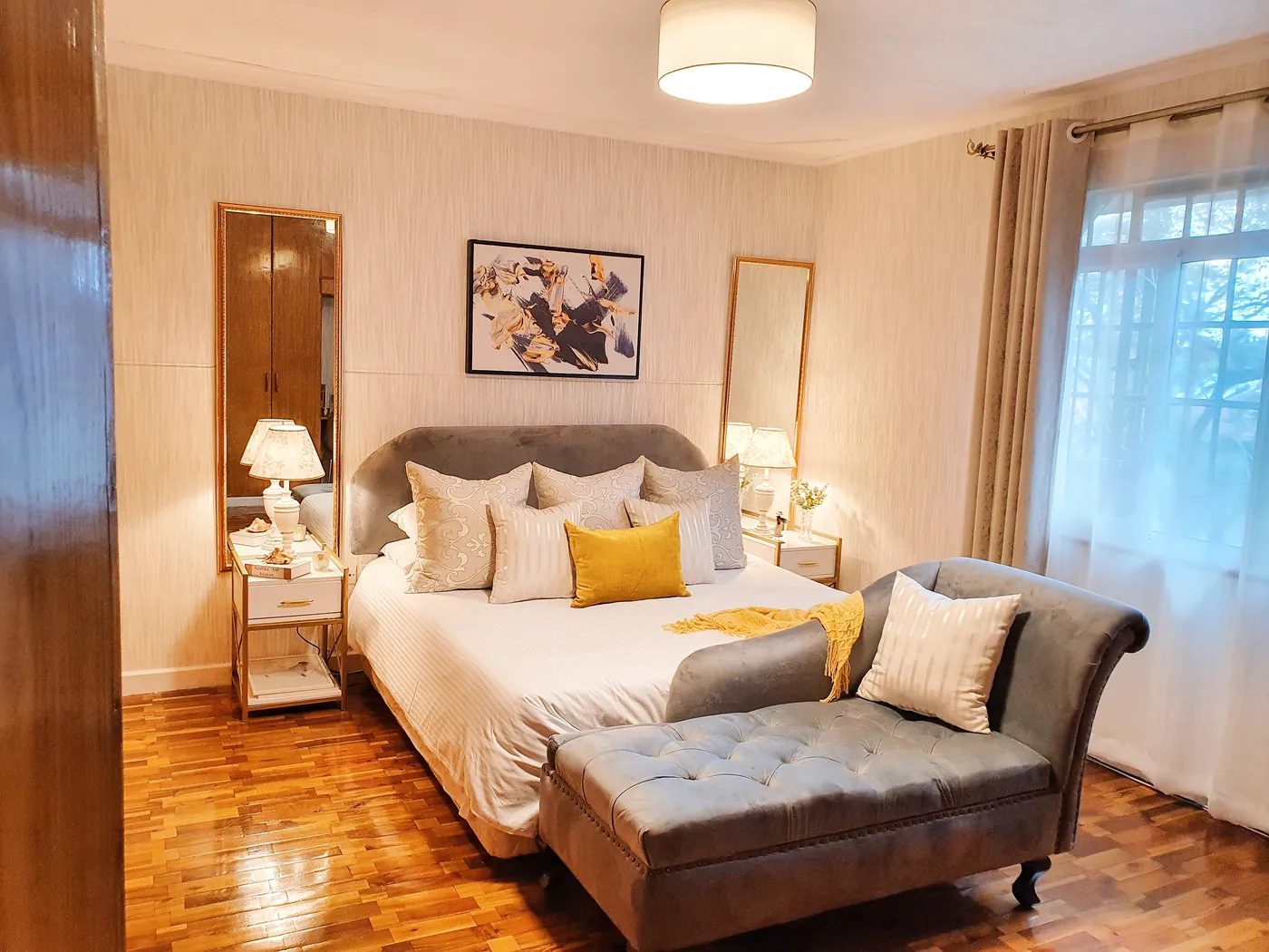 Apartment bedroom with upholstered bed and soft lighting, Syokimau