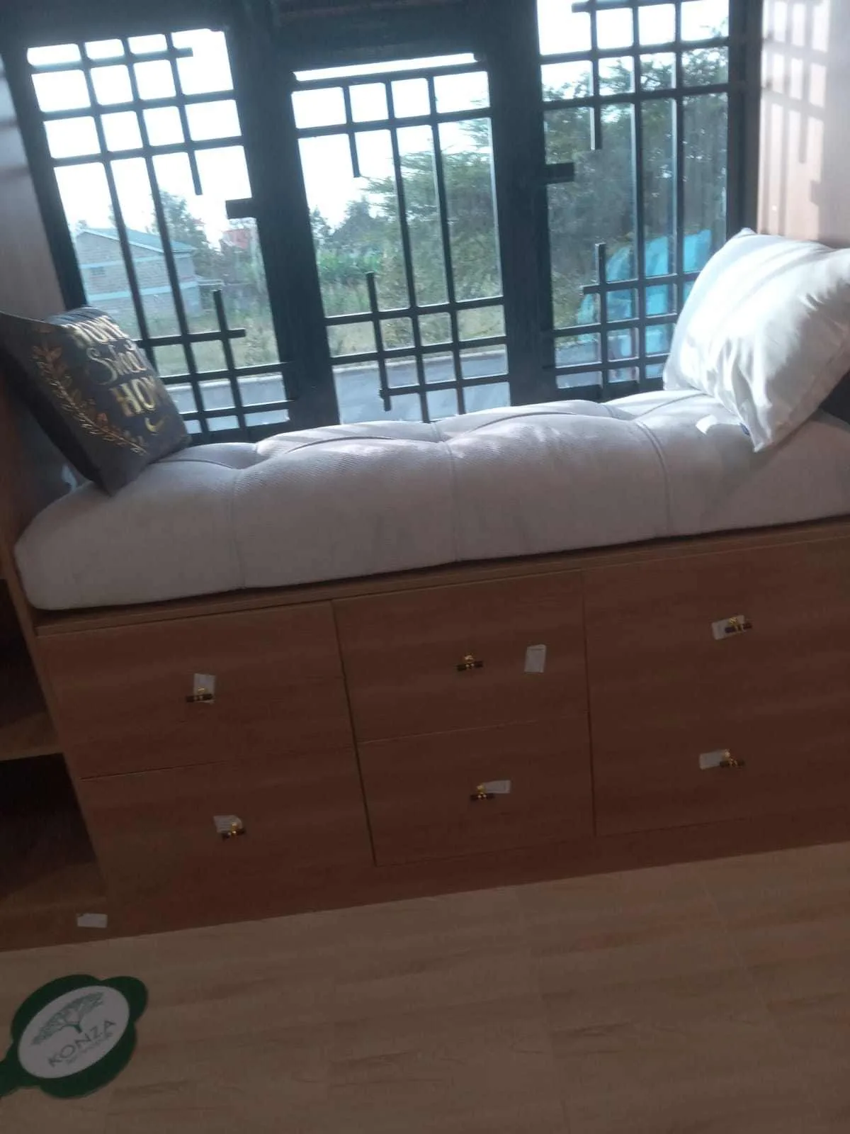 Window seat with cushion and storage drawers