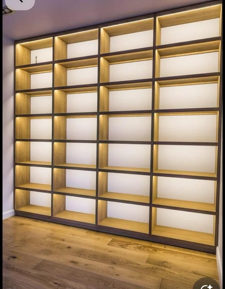 Fitted walk-in wardrobe with oak shelving and brass hardware, Nairobi
