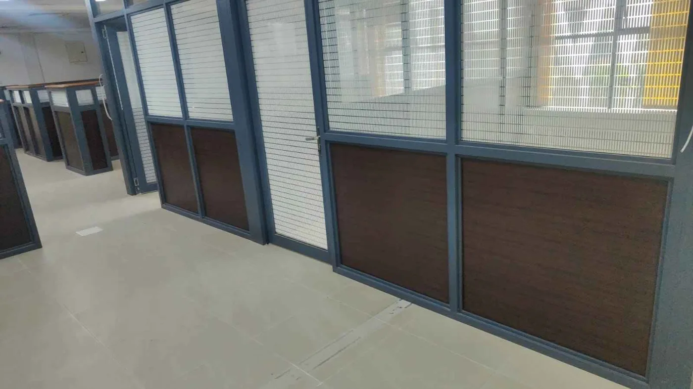 Finished office interior with glass partitions, desks and warm lighting, Nairobi