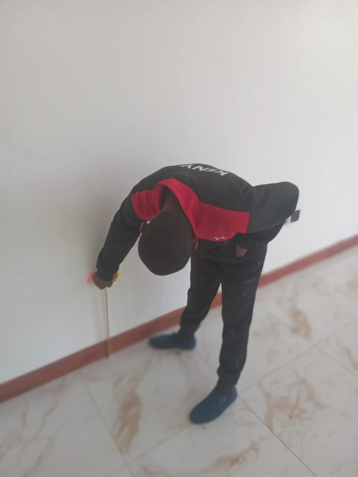 Warm wooden floor being fitted in a Nairobi living room